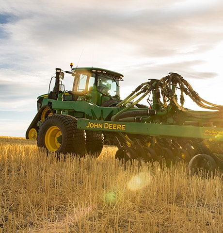 Tractor and sprayer in the field.